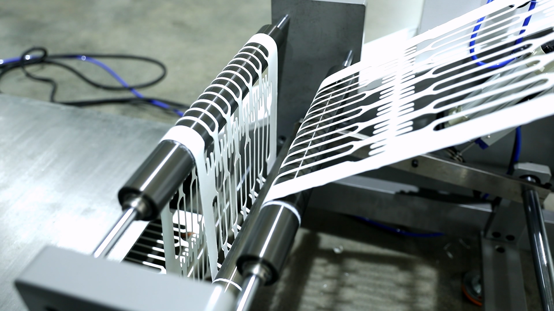 Waste material rewinding after die cutting